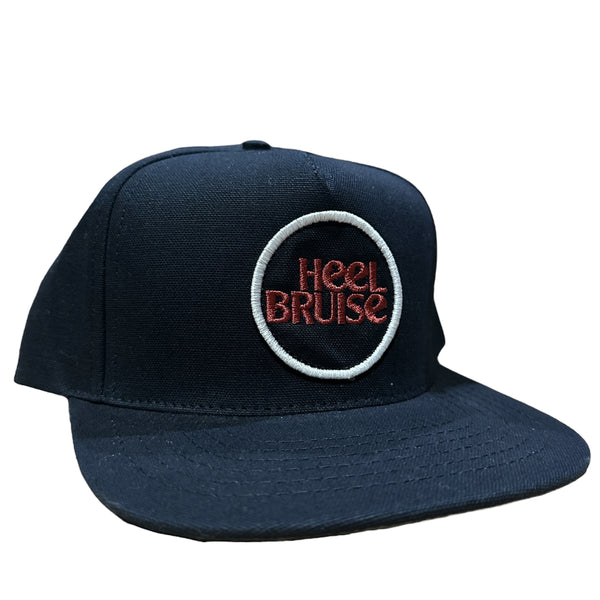 HEEL BRUISE SNAPBACK HAT BLACK